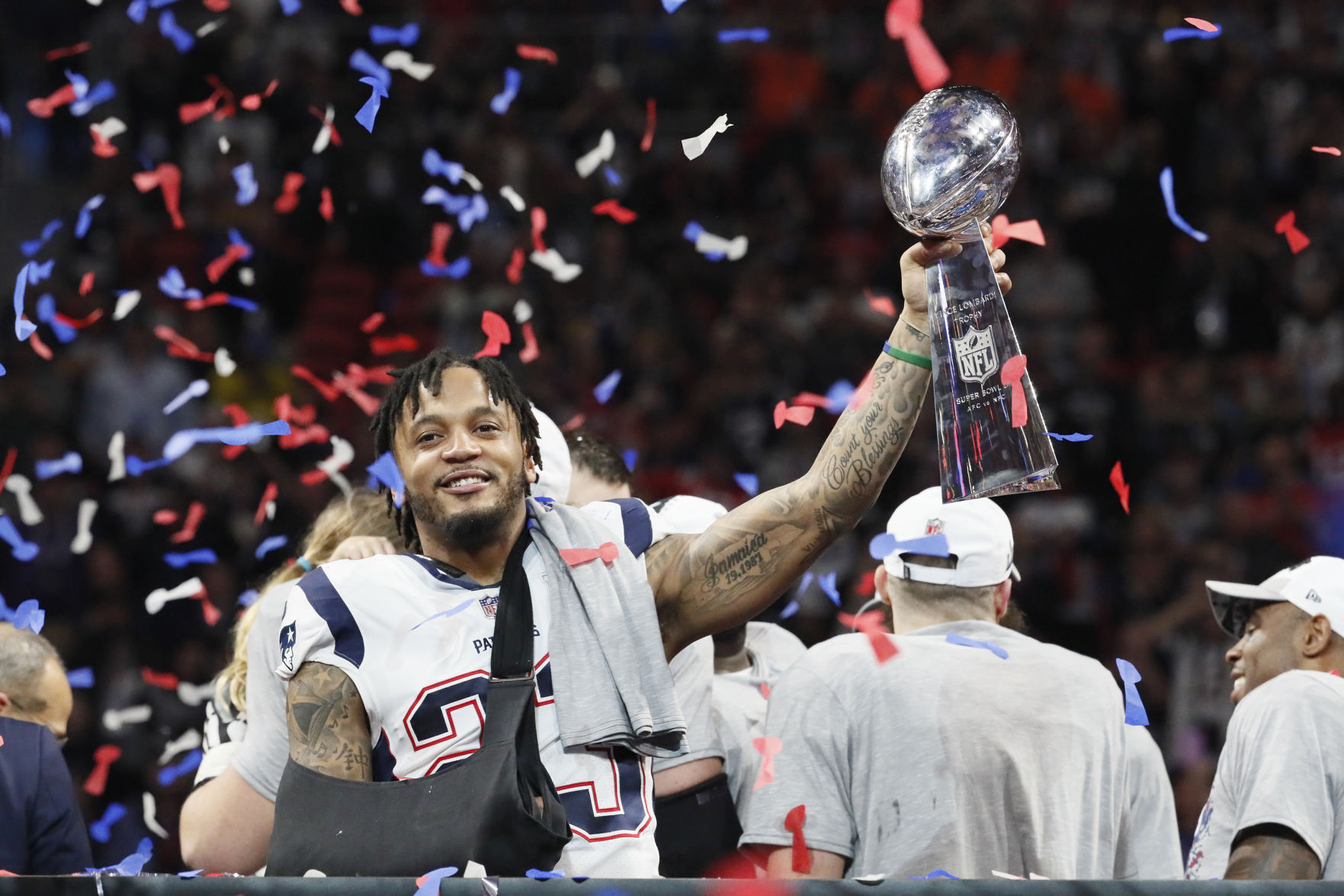 New England Patriots safety Patrick Chung (23) with the Vince Lombardi trophy after defeating the Los Angeles Rams, 13-3, in Super Bowl LIII at Mercedes-Benz Stadium in Atlanta on Sunday, Feb. 3, 2019.